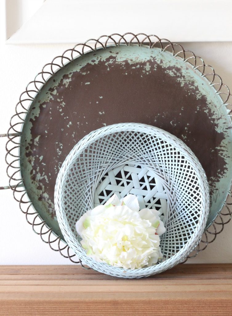 Create this SO EASY upcycled basket wreath with a thrifted basket and a can of spray paint. then add any faux flower or plant for seasonal color.